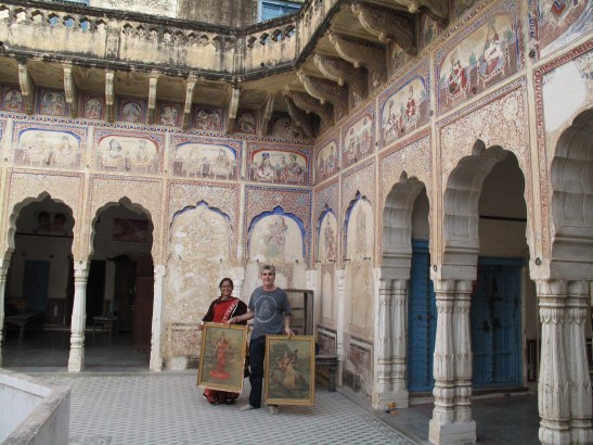 Mark holding god prints